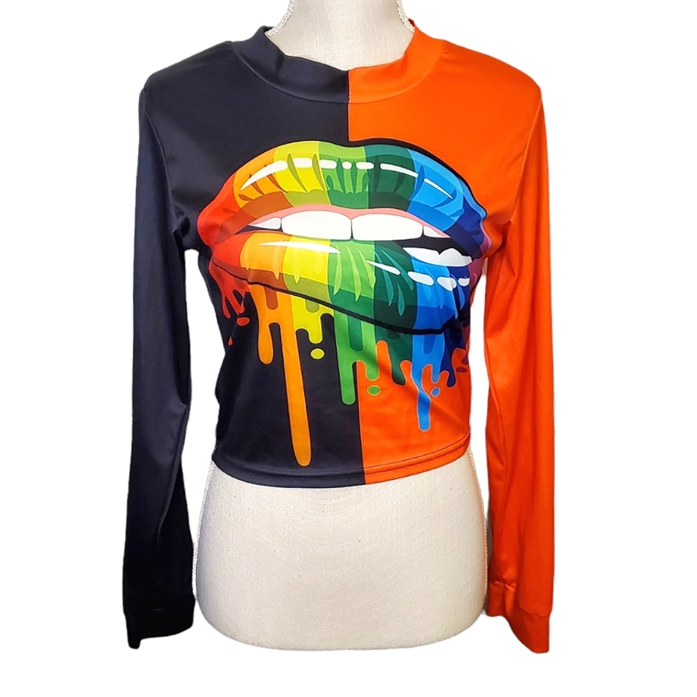 KAYLEE KOLLECTION | Women's orange and black lip bite graphic top. Size medium.